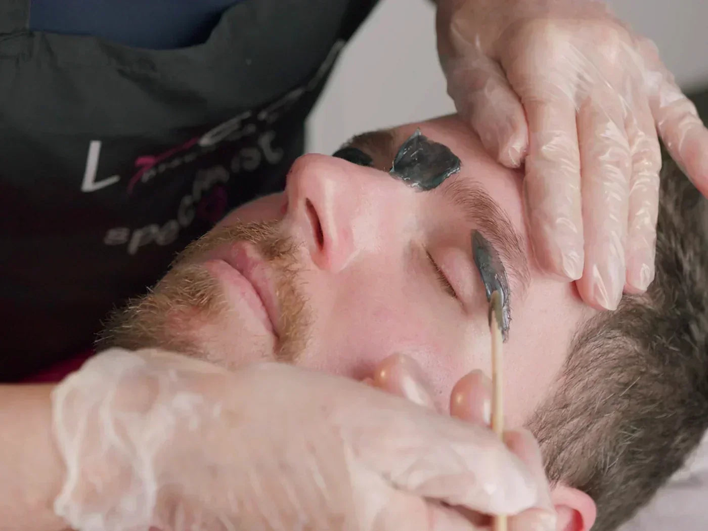 Man getting brow wax with LYCON MANifico Hot Wax