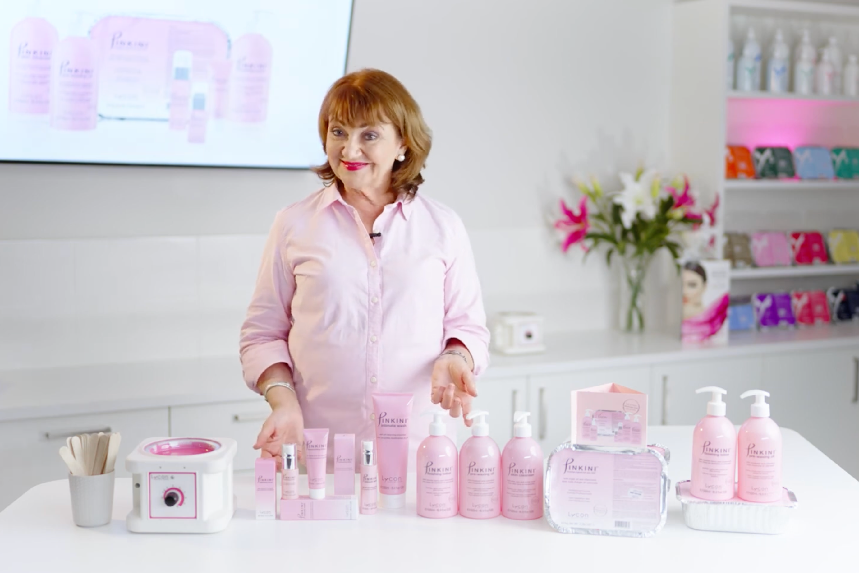 Lydia standing behind the Pinkini products