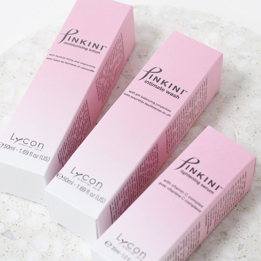 Photo of PINKINI Moisturising Lotion, Intimate Wash and Lightening Serum boxes lying side by side