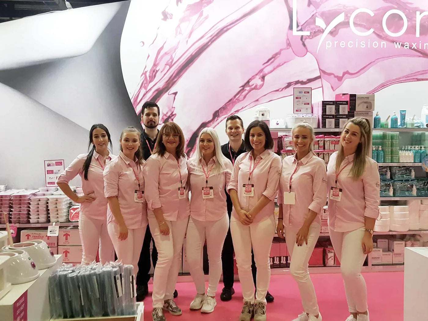 The LYCON Cosmetics team posting and smiling for a photo at the PINKINI Launch at Beauty Expo Australia