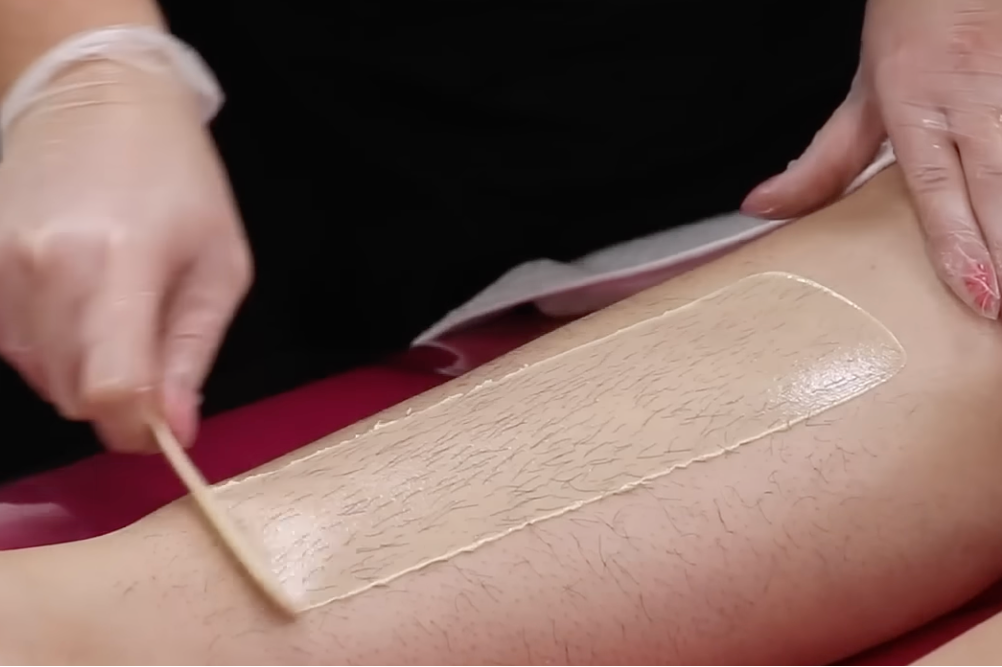 Strip Wax being applied to a hairy leg